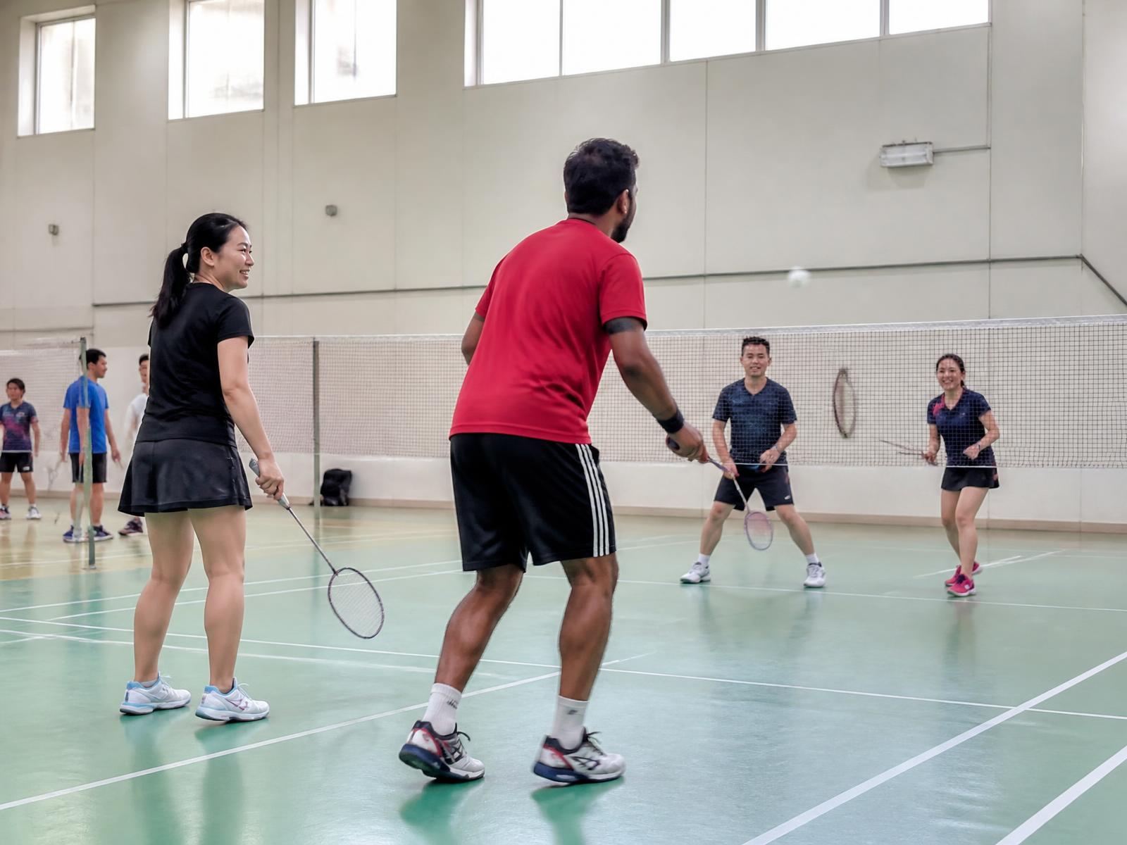 Community players enjoying a badminton session organized in Dubai